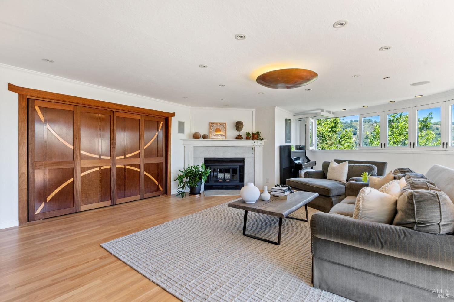 222 Marguerite Avenue Mill Valley, CA 94941 - Photo 9 of 59 a living room with furniture and a fireplace