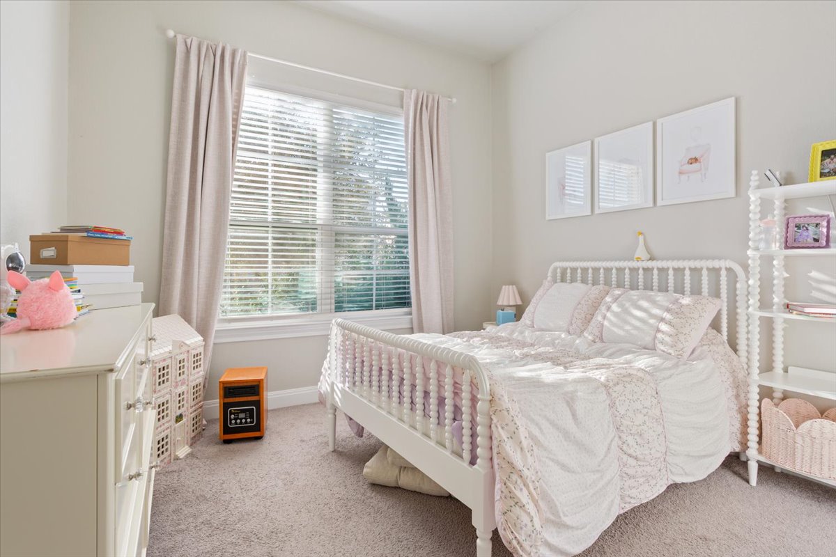 3814 Chance Loop Round Rock, TX 78628 - Photo 11 of 16 Bedroom with light carpet and baseboards