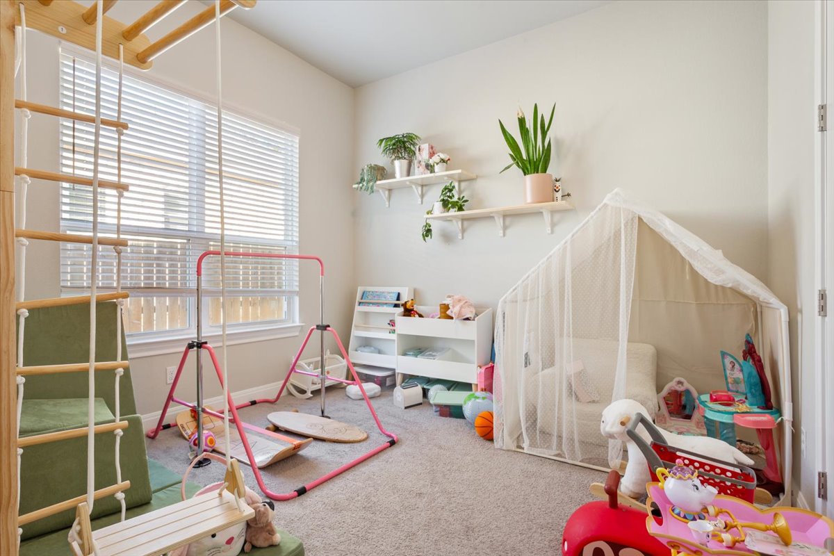 3814 Chance Loop Round Rock, TX 78628 - Photo 13 of 16 Game room with carpet flooring