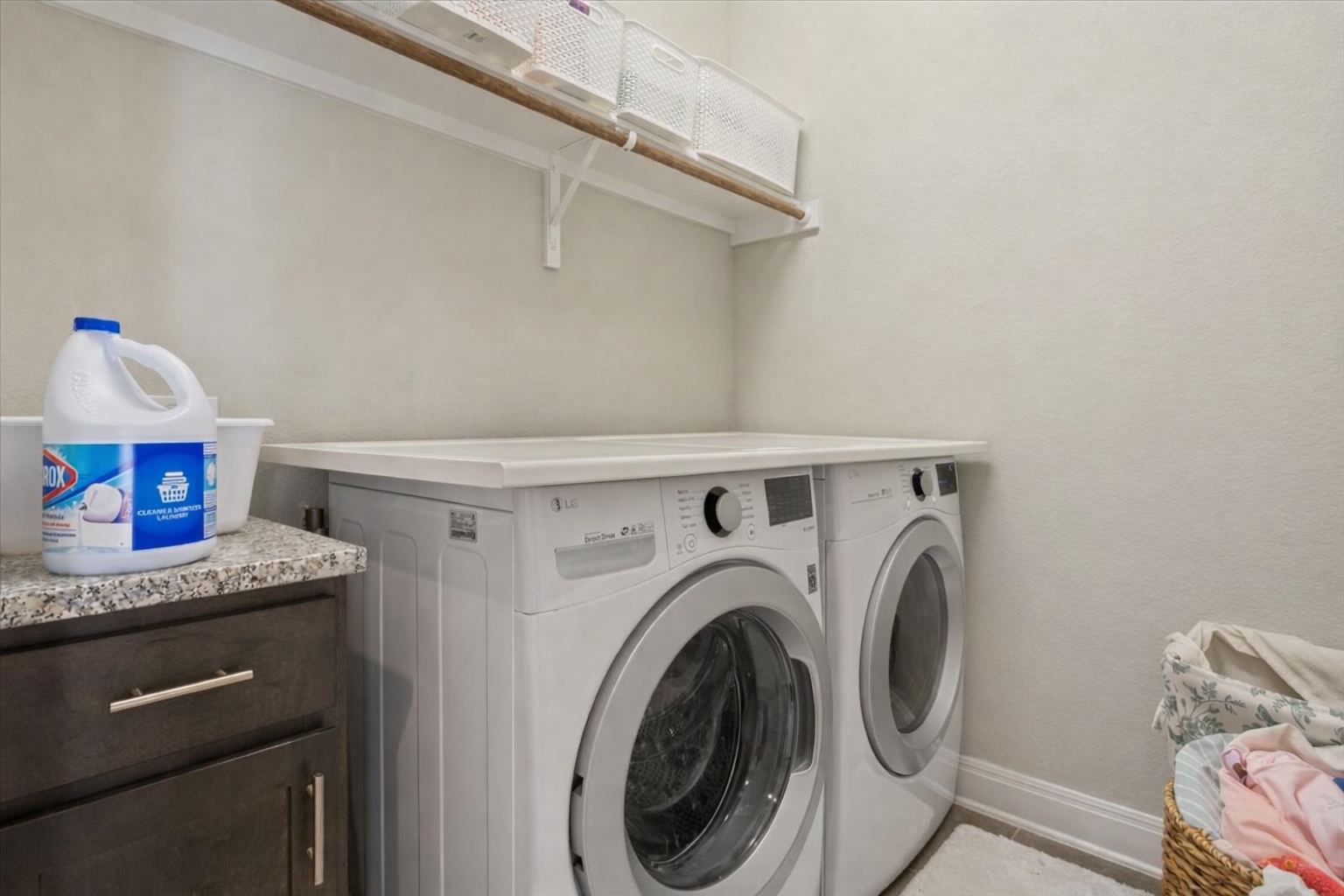 3814 Chance Loop Round Rock, TX 78628 - Photo 14 of 16 Laundry area featuring washing machine and dryer and cabinet space