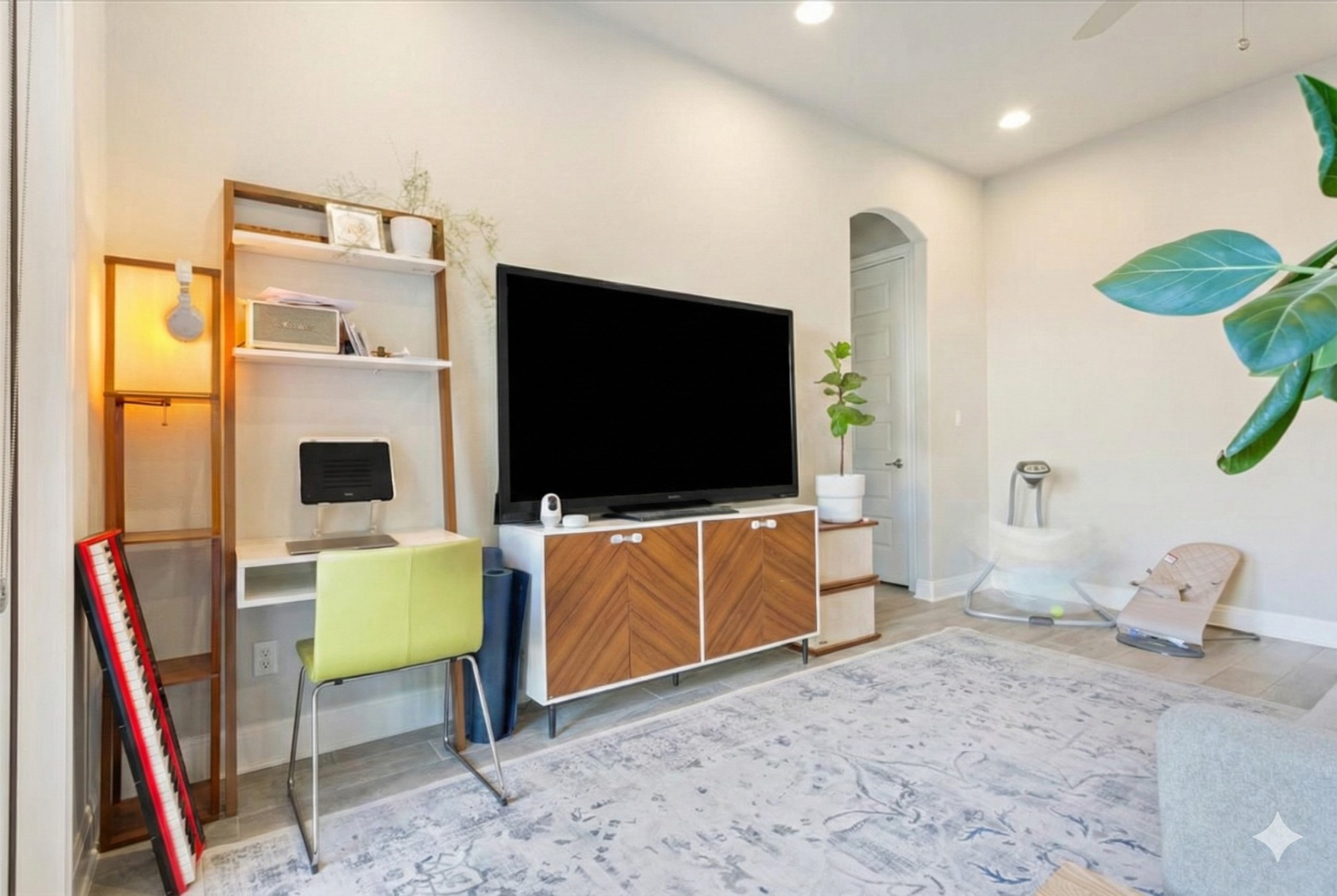 3814 Chance Loop Round Rock, TX 78628 - Photo 8 of 16 Living area with arched walkways, ceiling fan, recessed lighting, an office area, and light wood finished floors