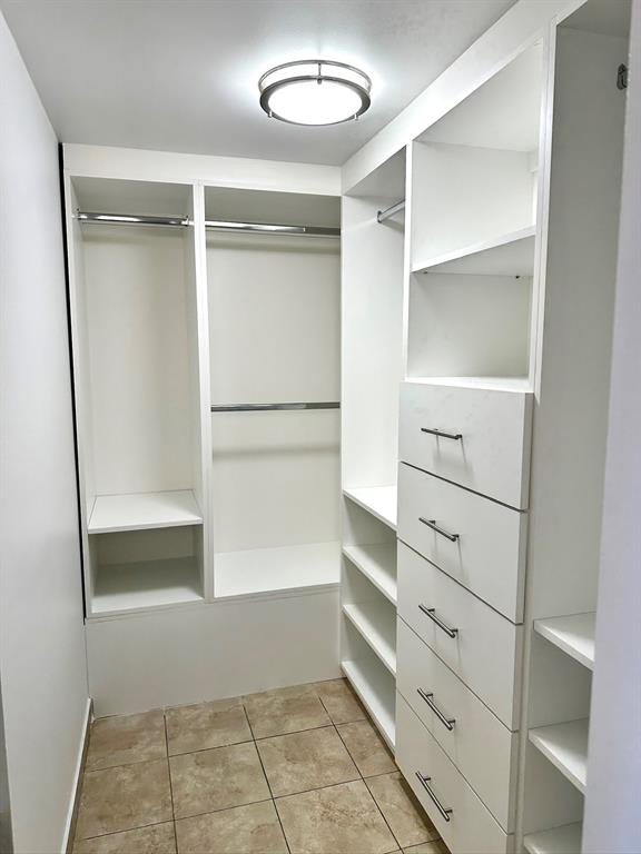 7355 West 4th Avenue, Unit 215 Hialeah, FL 33014 - Photo 11 of 17 a view of walk in closet with empty racks
