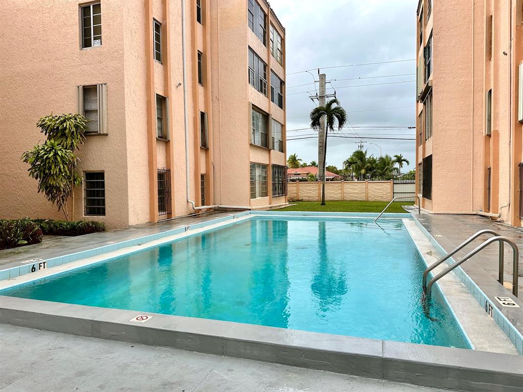 7355 West 4th Avenue, Unit 215 Hialeah, FL 33014 - Photo 16 of 17 swimming pool view from a balcony