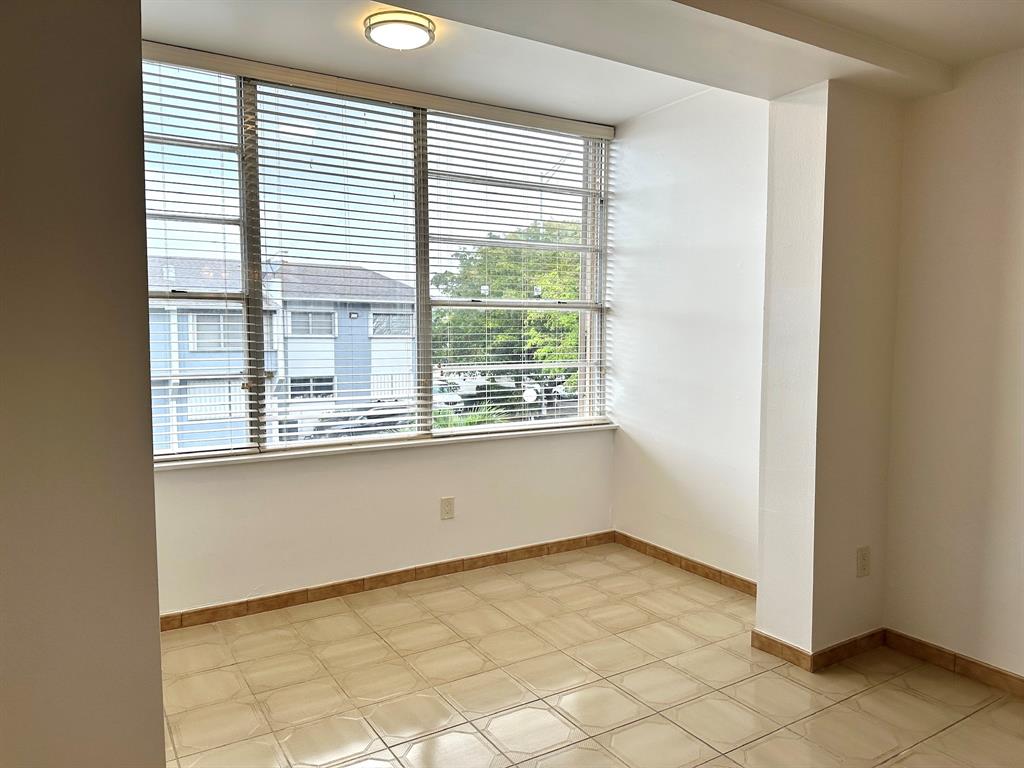 7355 West 4th Avenue, Unit 215 Hialeah, FL 33014 - Photo 6 of 17 a view of an empty room with a window