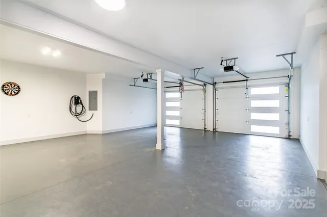 an aerial view of a house with roof deck and couches