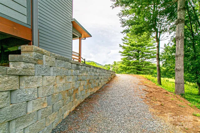 a view of a chairs and table in the balcony