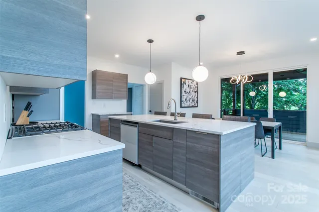a large kitchen with kitchen island a large island in the center