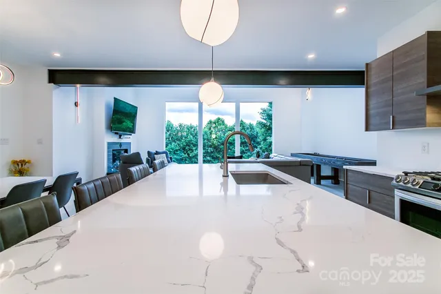 a large white kitchen with a large window