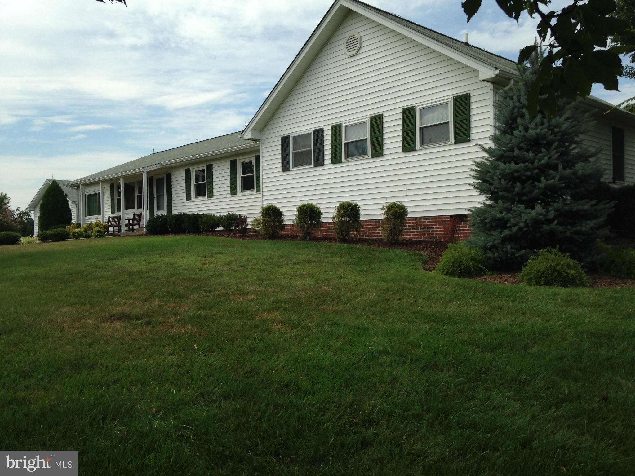 1355 Jewell Road Dunkirk, MD 20754 - Photo 1 of 30 a front view of a house with a garden