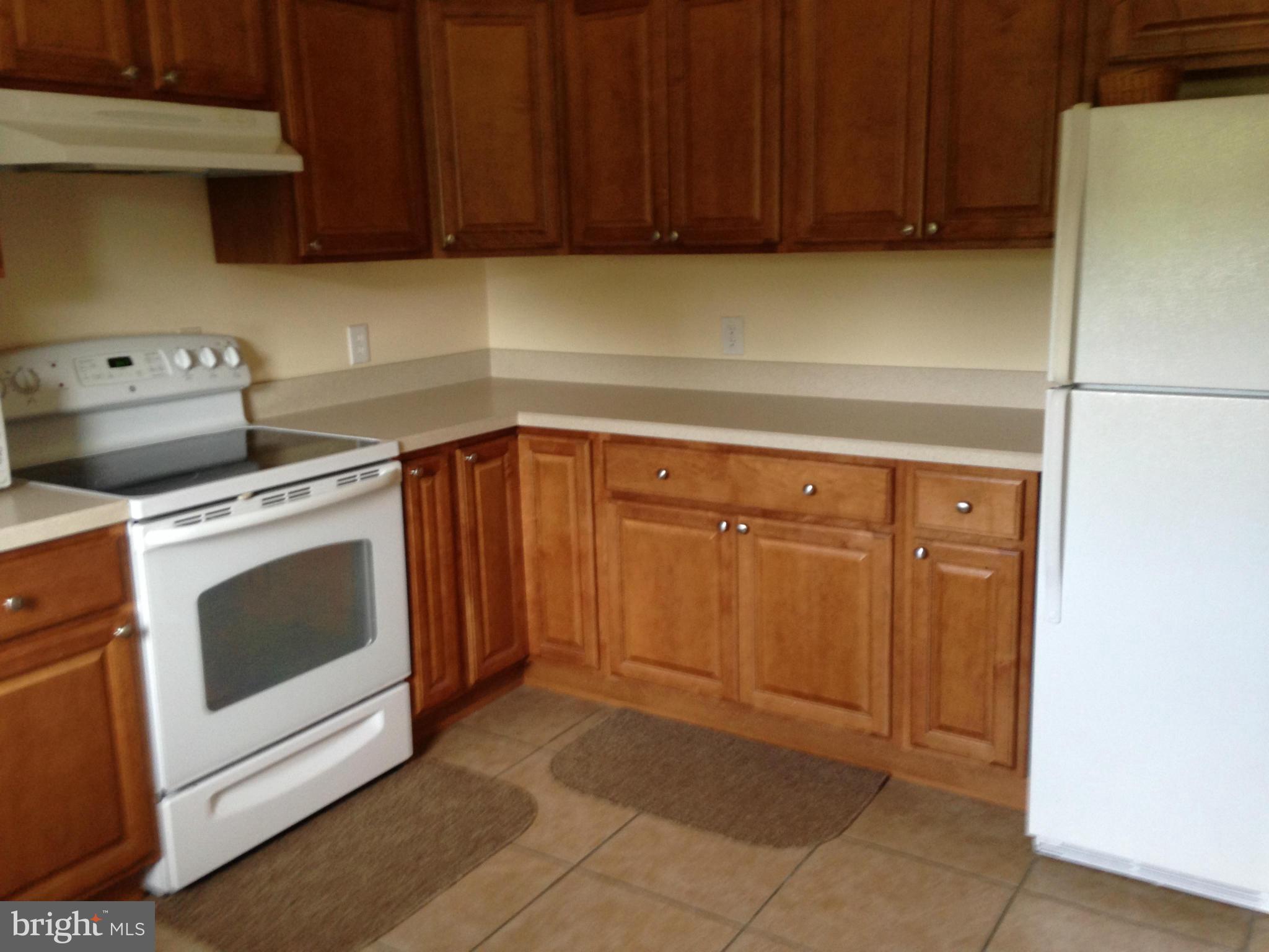 1355 Jewell Road Dunkirk, MD 20754 - Photo 13 of 30 a kitchen with a stove top oven cabinets and stainless steel appliances