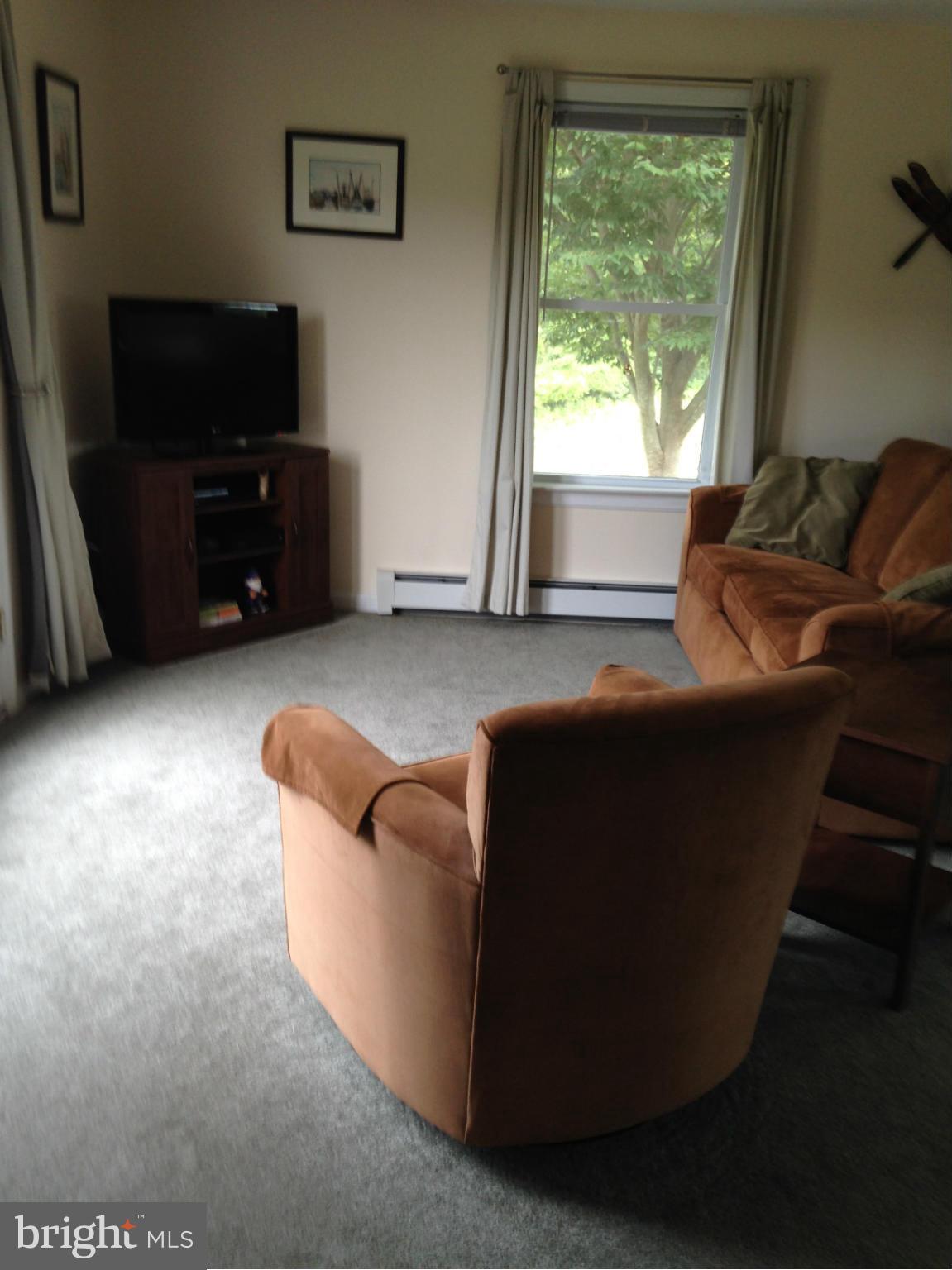 1355 Jewell Road Dunkirk, MD 20754 - Photo 19 of 30 a living room with furniture and a flat screen tv
