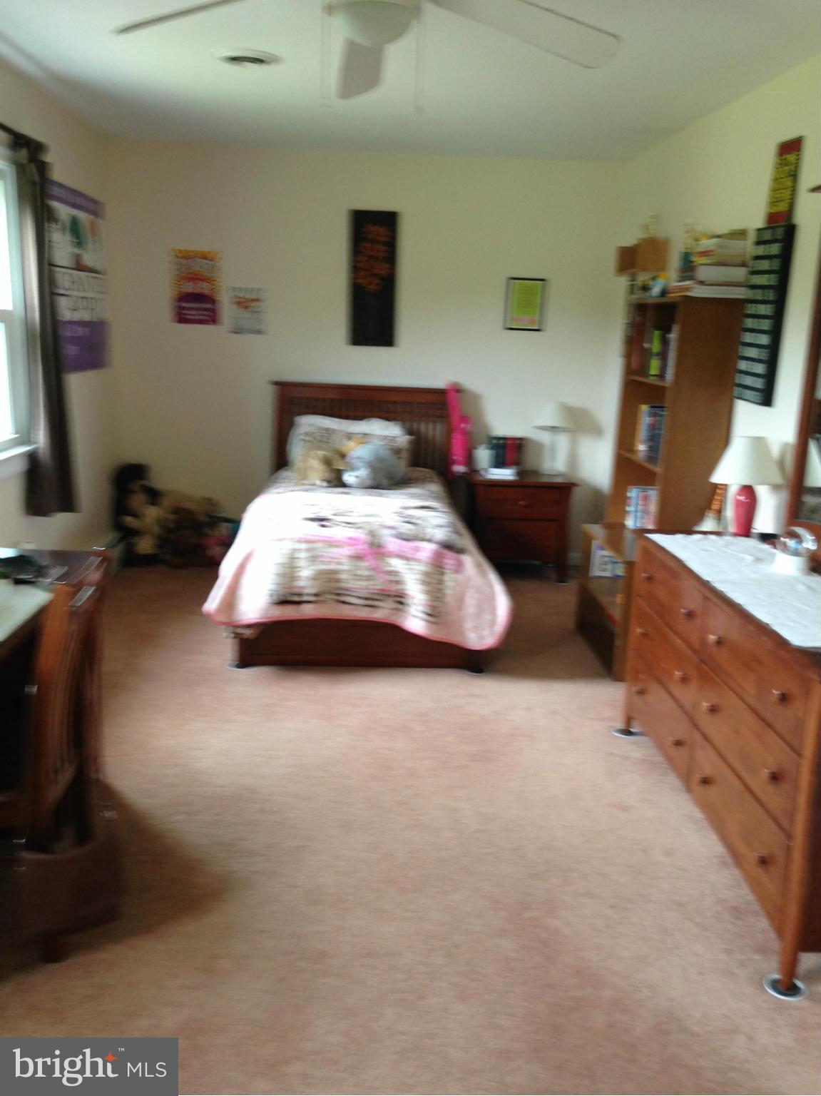 1355 Jewell Road Dunkirk, MD 20754 - Photo 21 of 30 a bedroom with a bed and a tv on the dresser