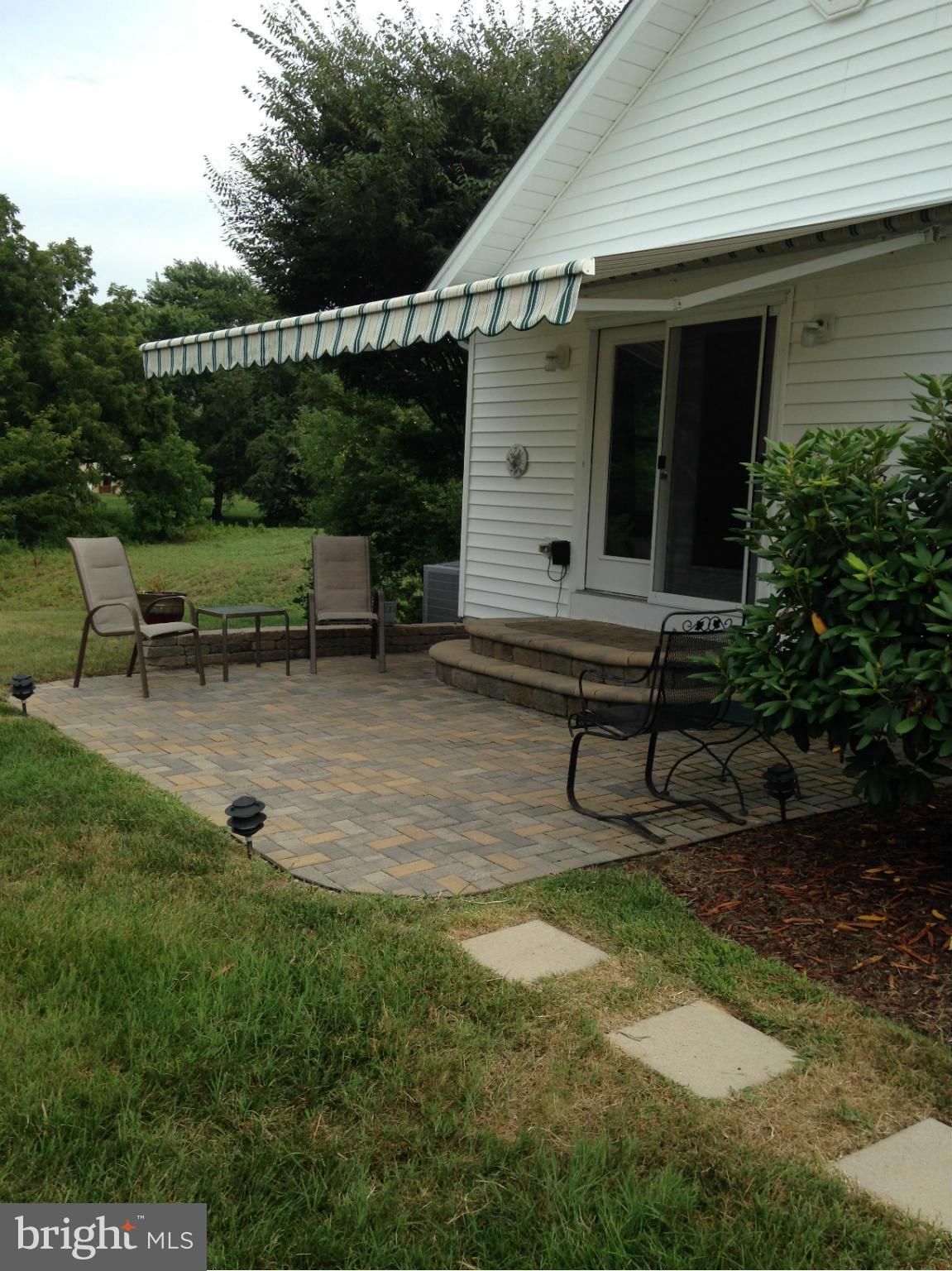 1355 Jewell Road Dunkirk, MD 20754 - Photo 24 of 30 a backyard of a house with table and chairs