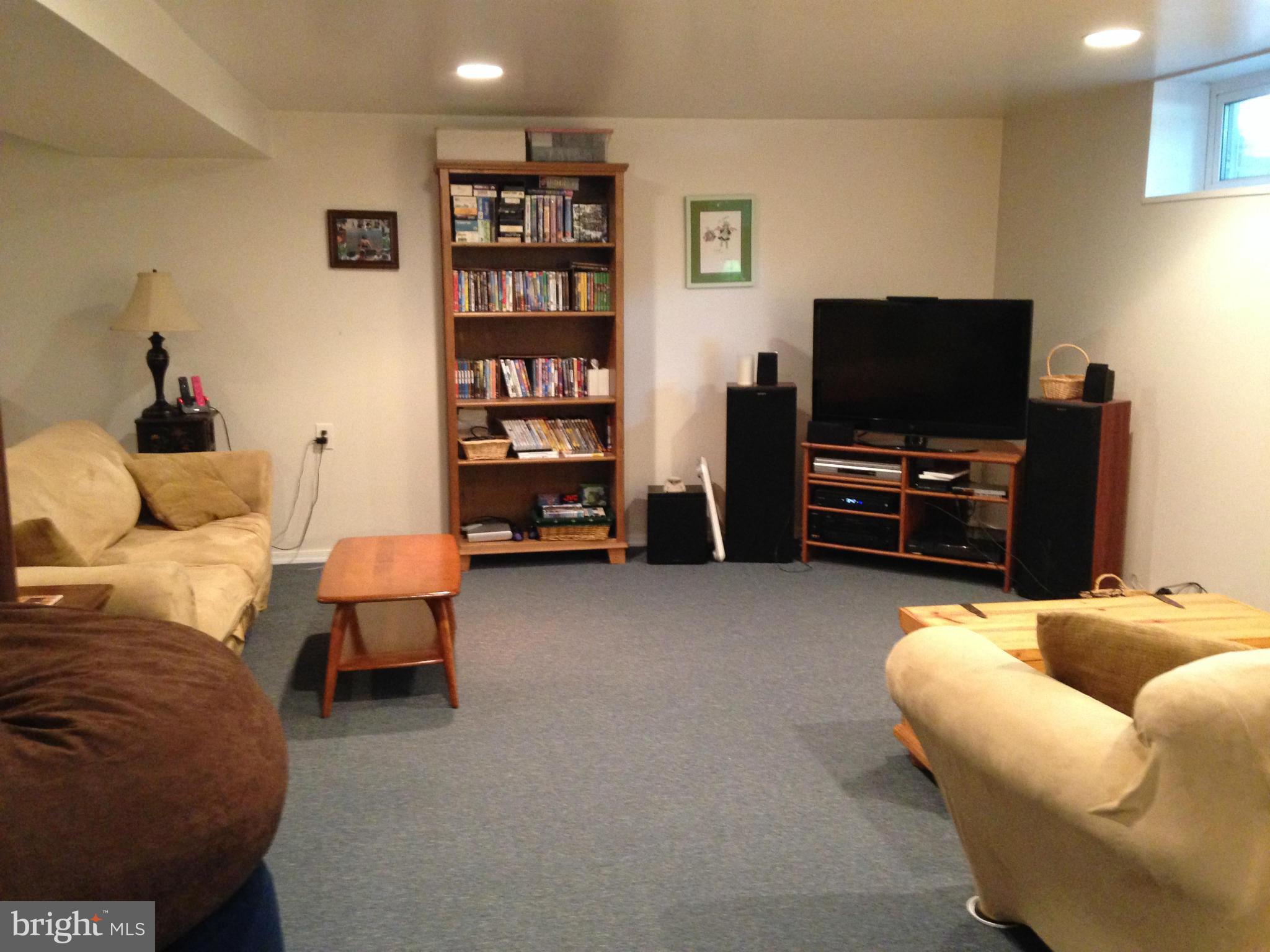 1355 Jewell Road Dunkirk, MD 20754 - Photo 25 of 30 a living room with furniture and a flat screen tv