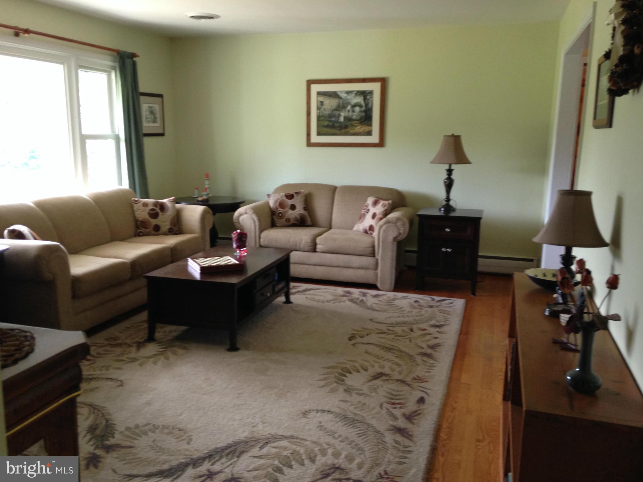 1355 Jewell Road Dunkirk, MD 20754 - Photo 10 of 30 a living room with furniture and a lamp
