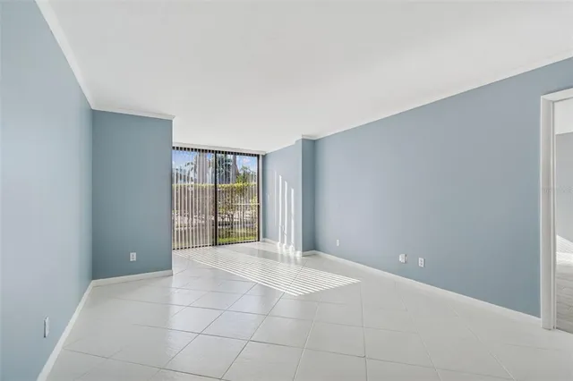 a metallic refrigerator sitting in a kitchen