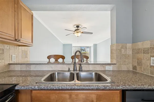 a view of room with window and refrigerator