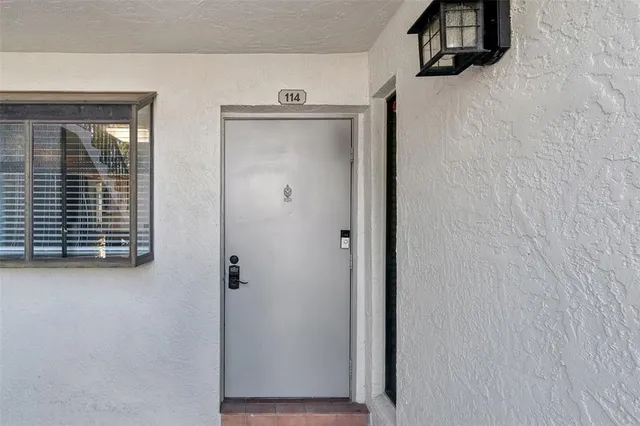 a view of an empty room with windows