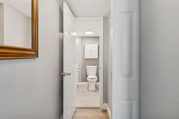 a bathroom with a sink toilet a mirror and shower