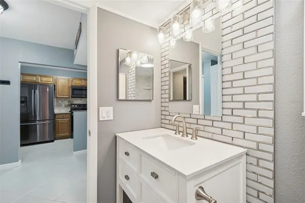 a living room with furniture a floor to ceiling window and gym equipment