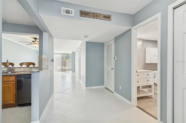 a view of a livingroom with furniture and a ceiling fan