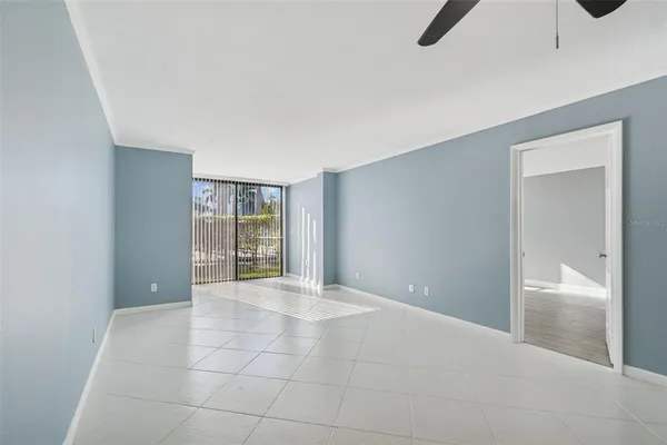 a view of a livingroom with furniture and a ceiling fan