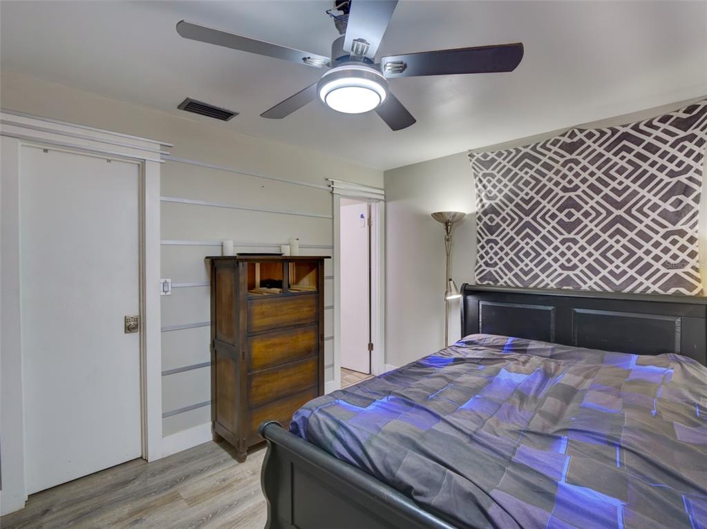 37149 Grays Airport Road Lady Lake, FL 32159 - Photo 12 of 36 a bedroom with a bed and a closet