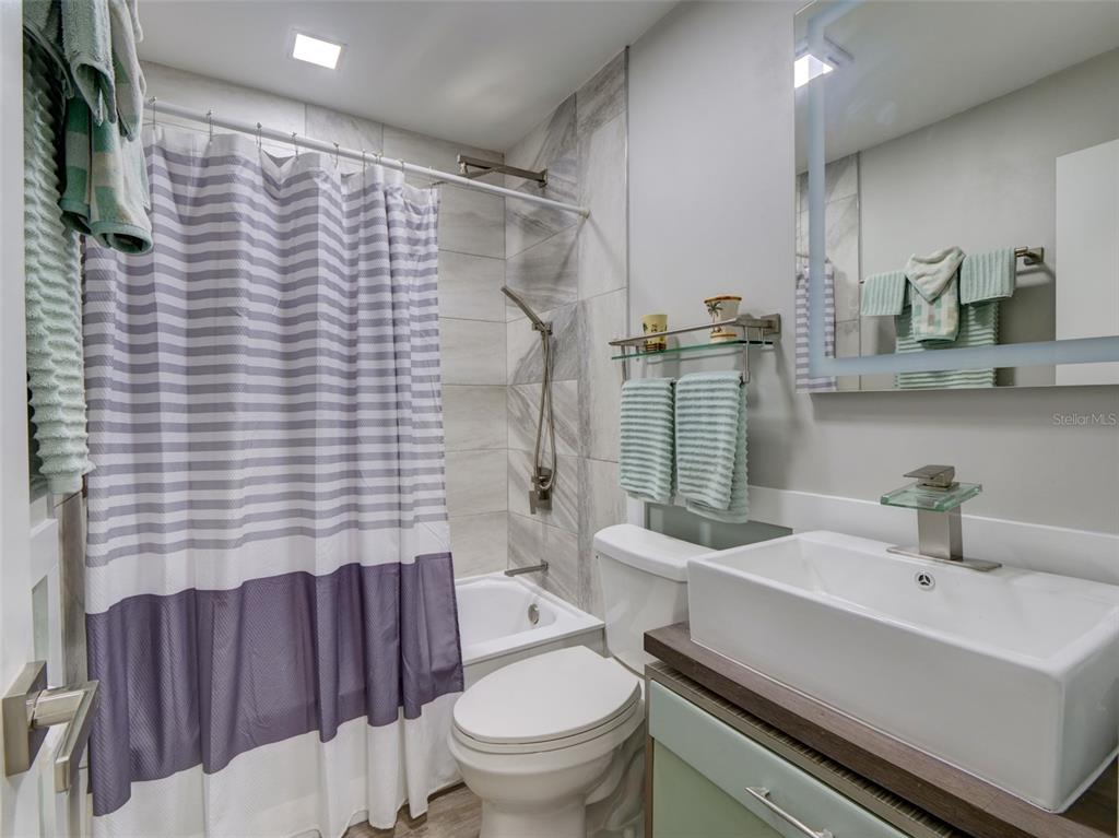 37149 Grays Airport Road Lady Lake, FL 32159 - Photo 15 of 36 a bathroom with a sink toilet and shower