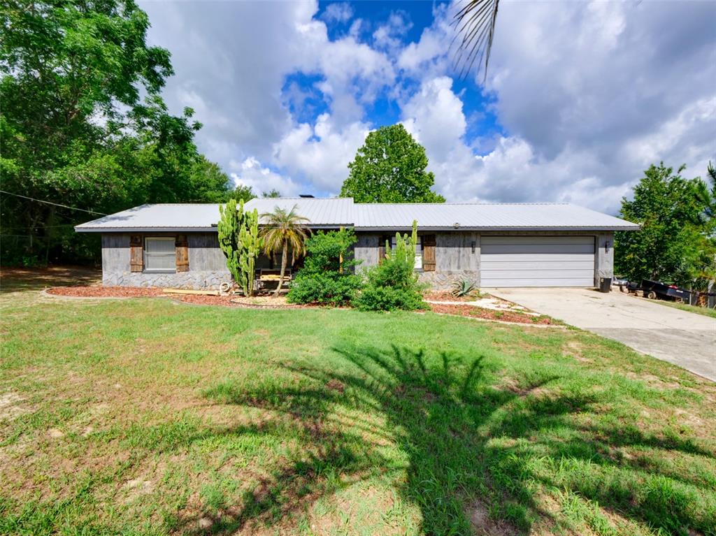 37149 Grays Airport Road Lady Lake, FL 32159 - Photo 19 of 36 a view front of house with a yard
