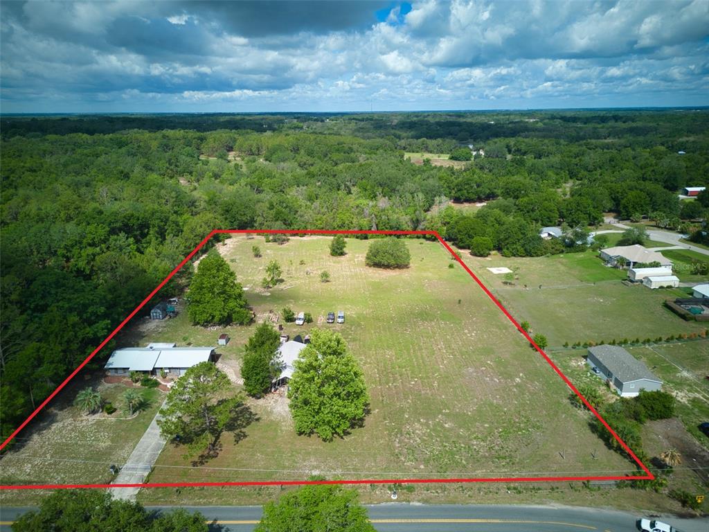 37149 Grays Airport Road Lady Lake, FL 32159 - Photo 2 of 36 a view of a back yard of the house