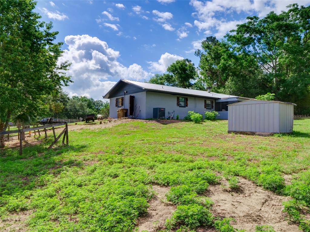37149 Grays Airport Road Lady Lake, FL 32159 - Photo 23 of 36 a house view with a garden space