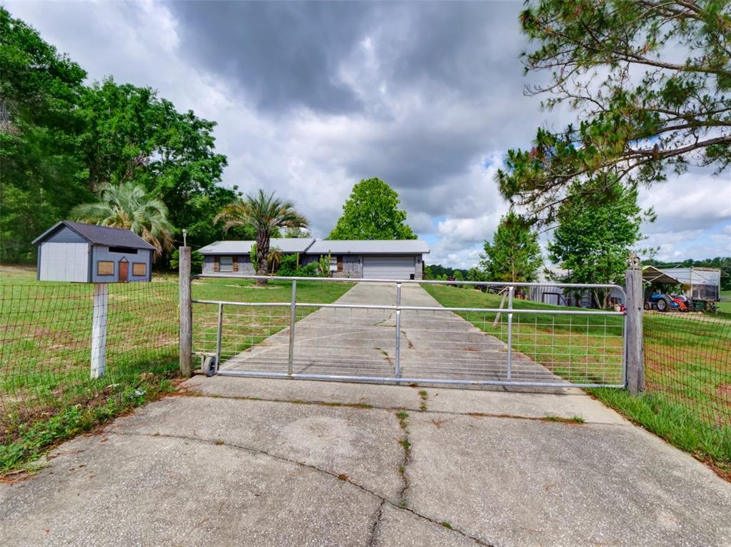 37149 Grays Airport Road Lady Lake, FL 32159 - Photo 28 of 36 a view of a park with large trees