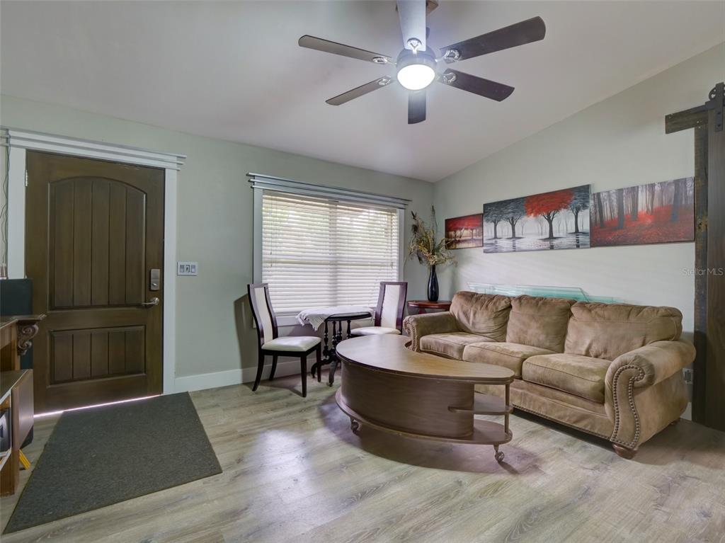 37149 Grays Airport Road Lady Lake, FL 32159 - Photo 4 of 36 a living room with furniture and a window