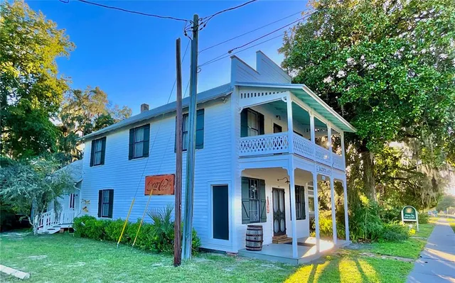 a view of a street with cars on the road