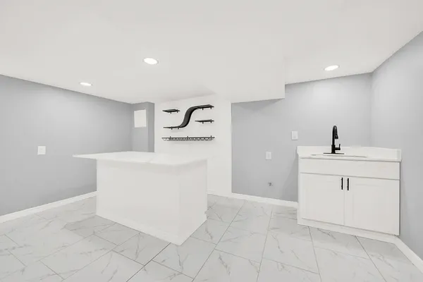 a bathroom with a sink a vanity and a mirror