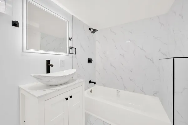 a bathroom with a sink and a bathtub