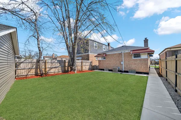a view of a back yard of the house