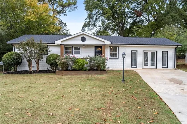 a front view of a house with garden