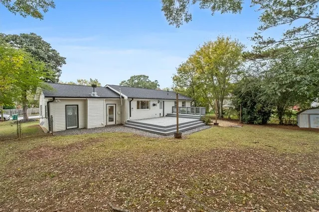 a house with trees in the background