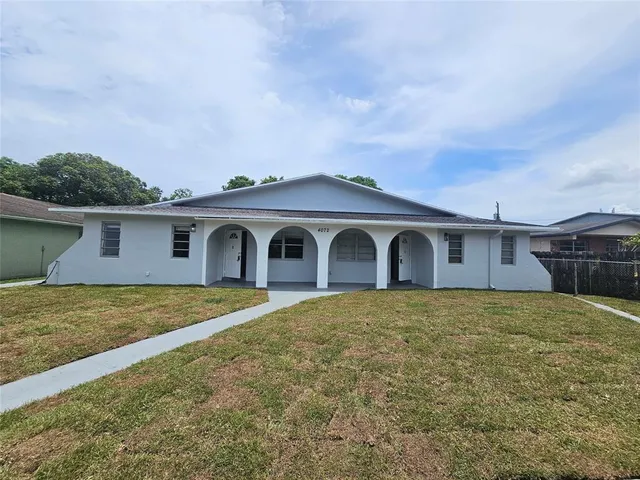 a front view of a house with yard