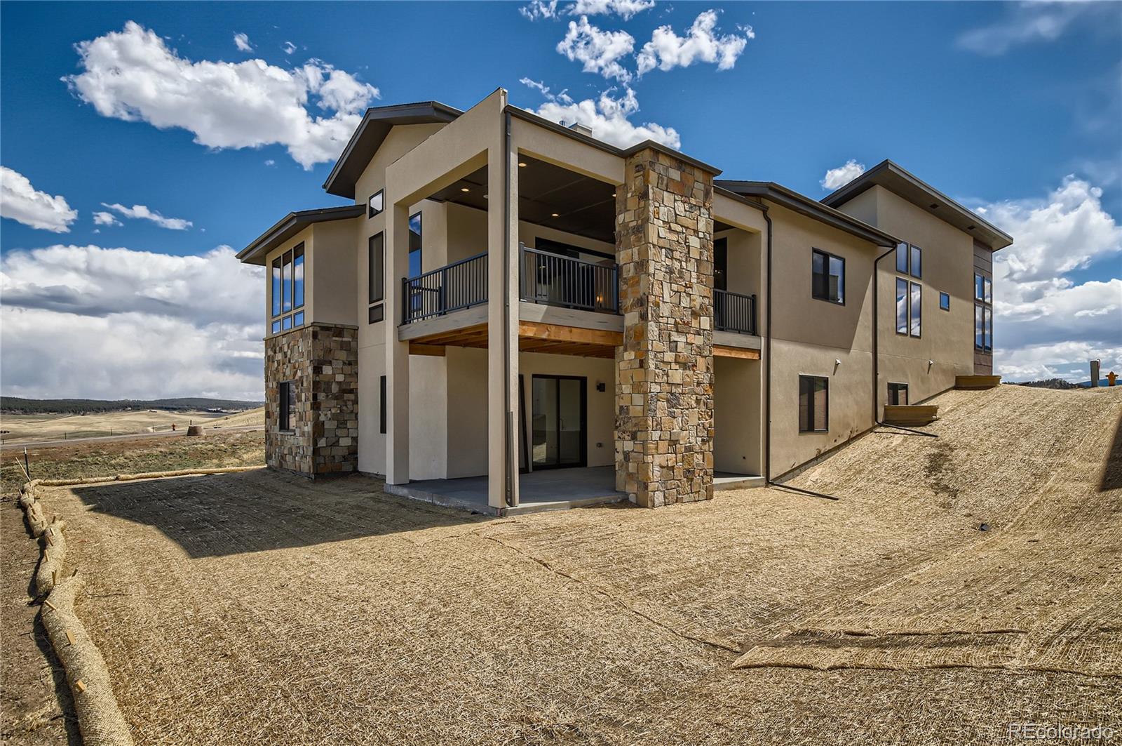 5741 Doc Bar Circle Sedalia, CO 80135 - Photo 1 of 24 a view of a house with a yard