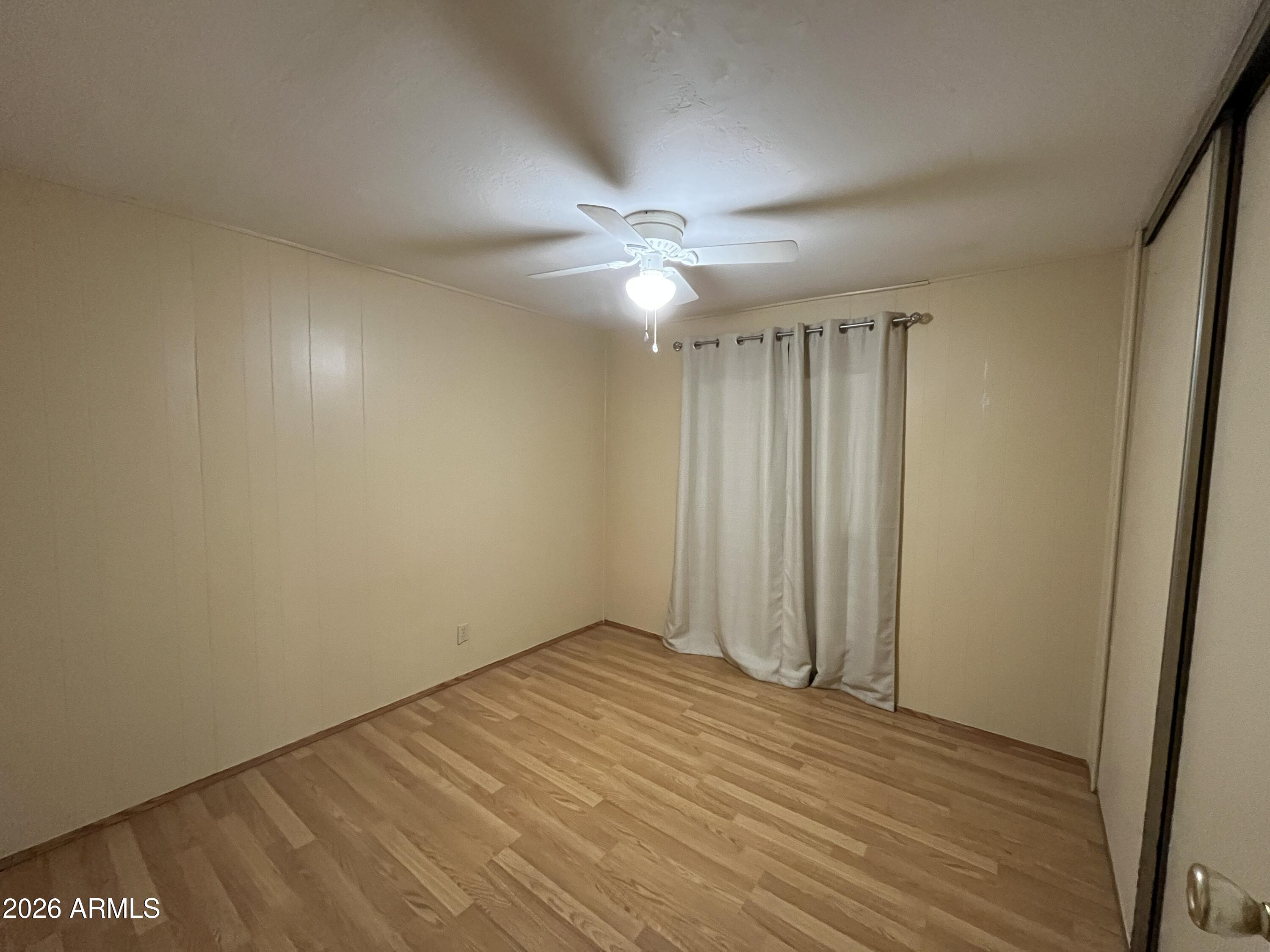 9302 East Broadway Road, Unit 179 Mesa, AZ 85208 - Photo 15 of 54 wooden floor in an empty room