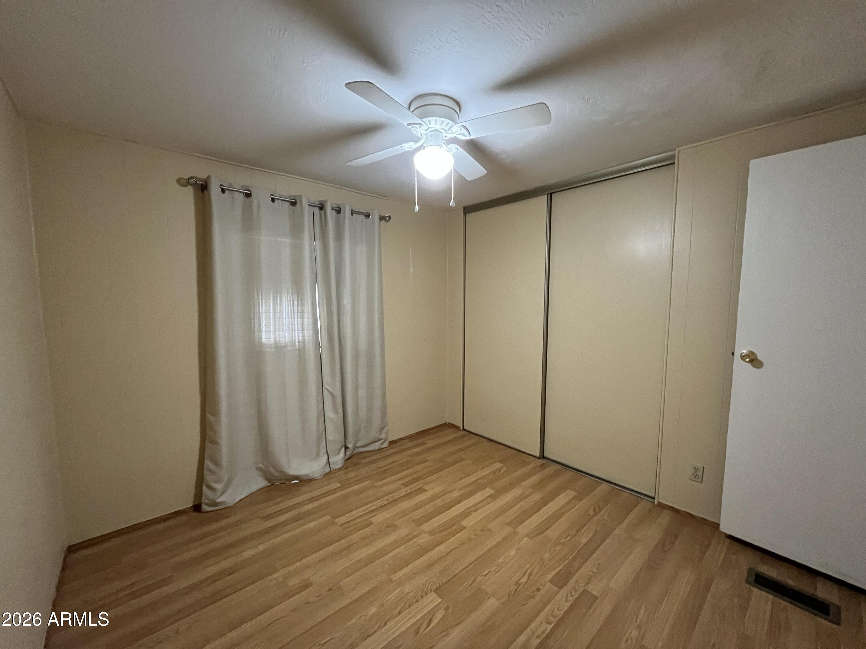 9302 East Broadway Road, Unit 179 Mesa, AZ 85208 - Photo 16 of 54 wooden floor in an empty room