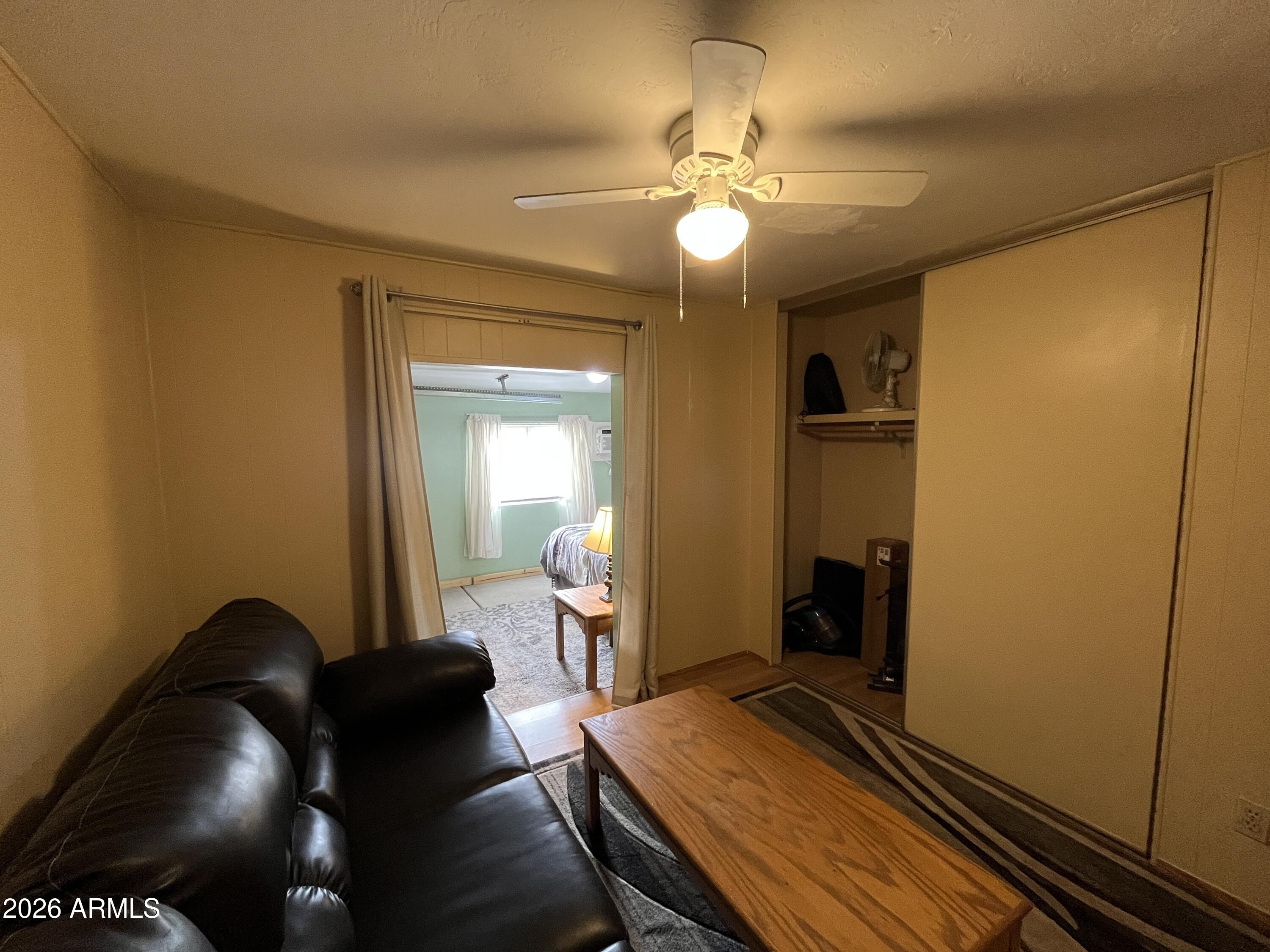 9302 East Broadway Road, Unit 179 Mesa, AZ 85208 - Photo 19 of 54 a bedroom with a bed and wooden floor