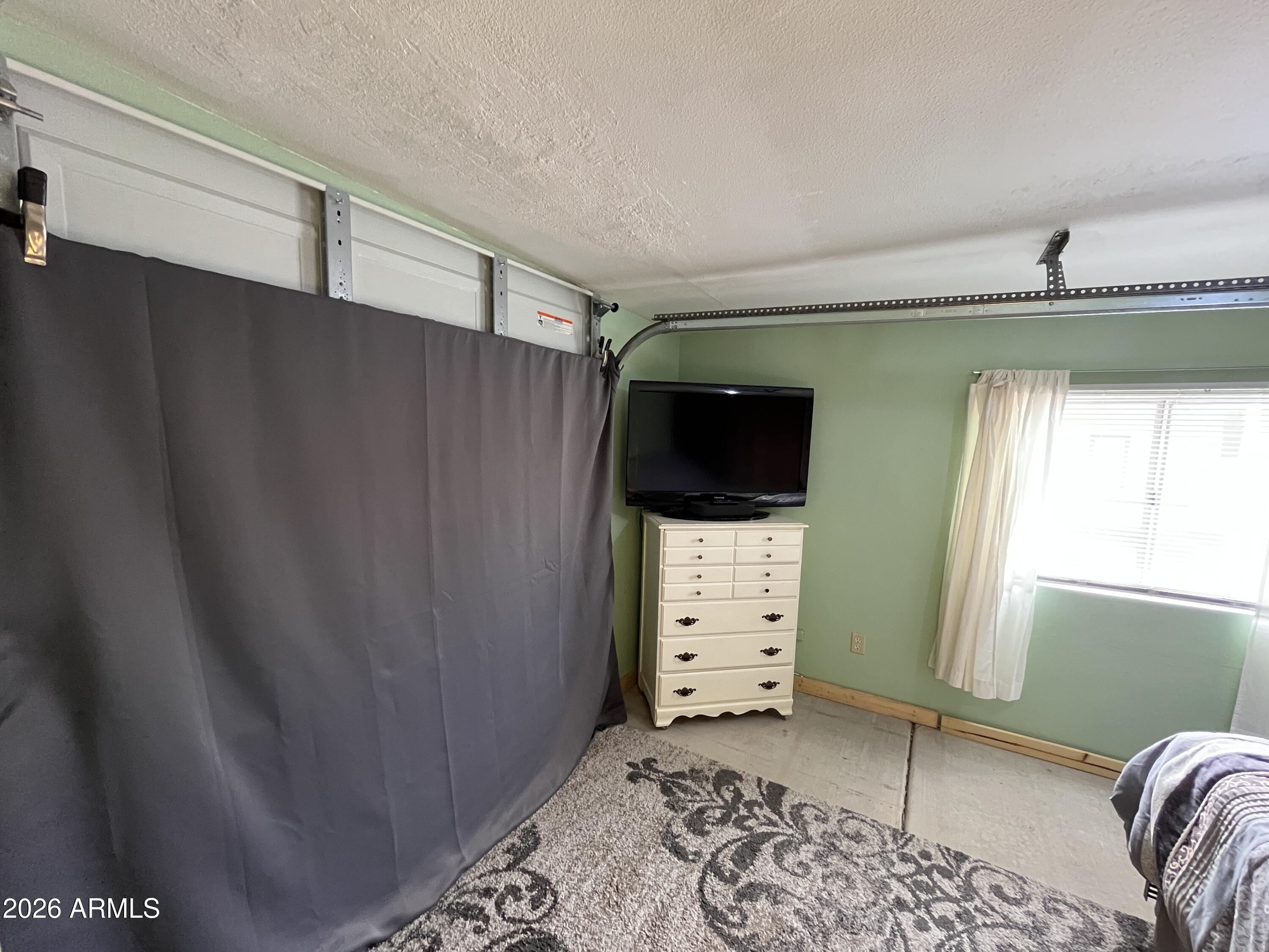 9302 East Broadway Road, Unit 179 Mesa, AZ 85208 - Photo 21 of 54 a view of a livingroom with furniture and windows