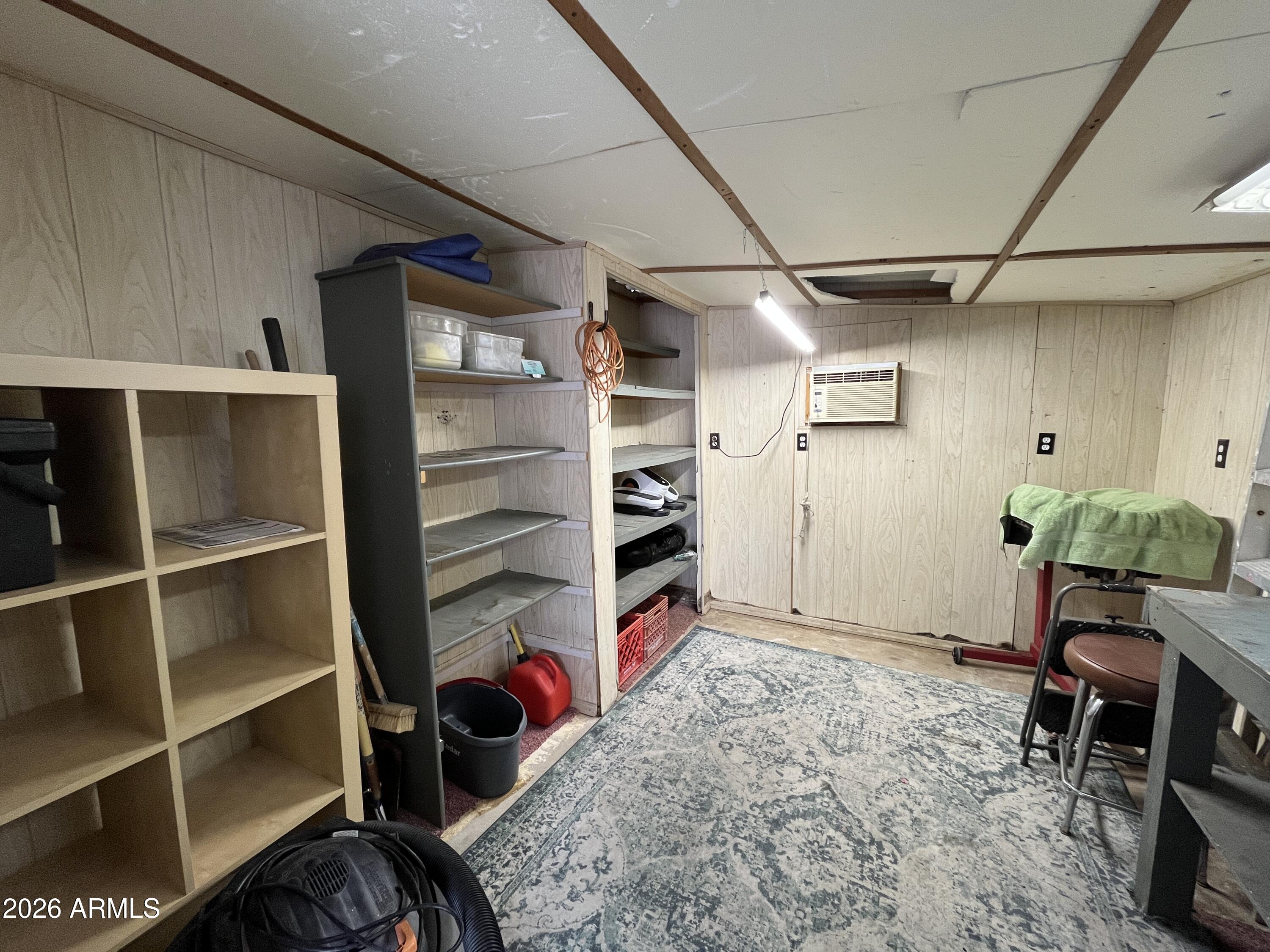 9302 East Broadway Road, Unit 179 Mesa, AZ 85208 - Photo 40 of 54 a view of walk in closet with clothes and shoes