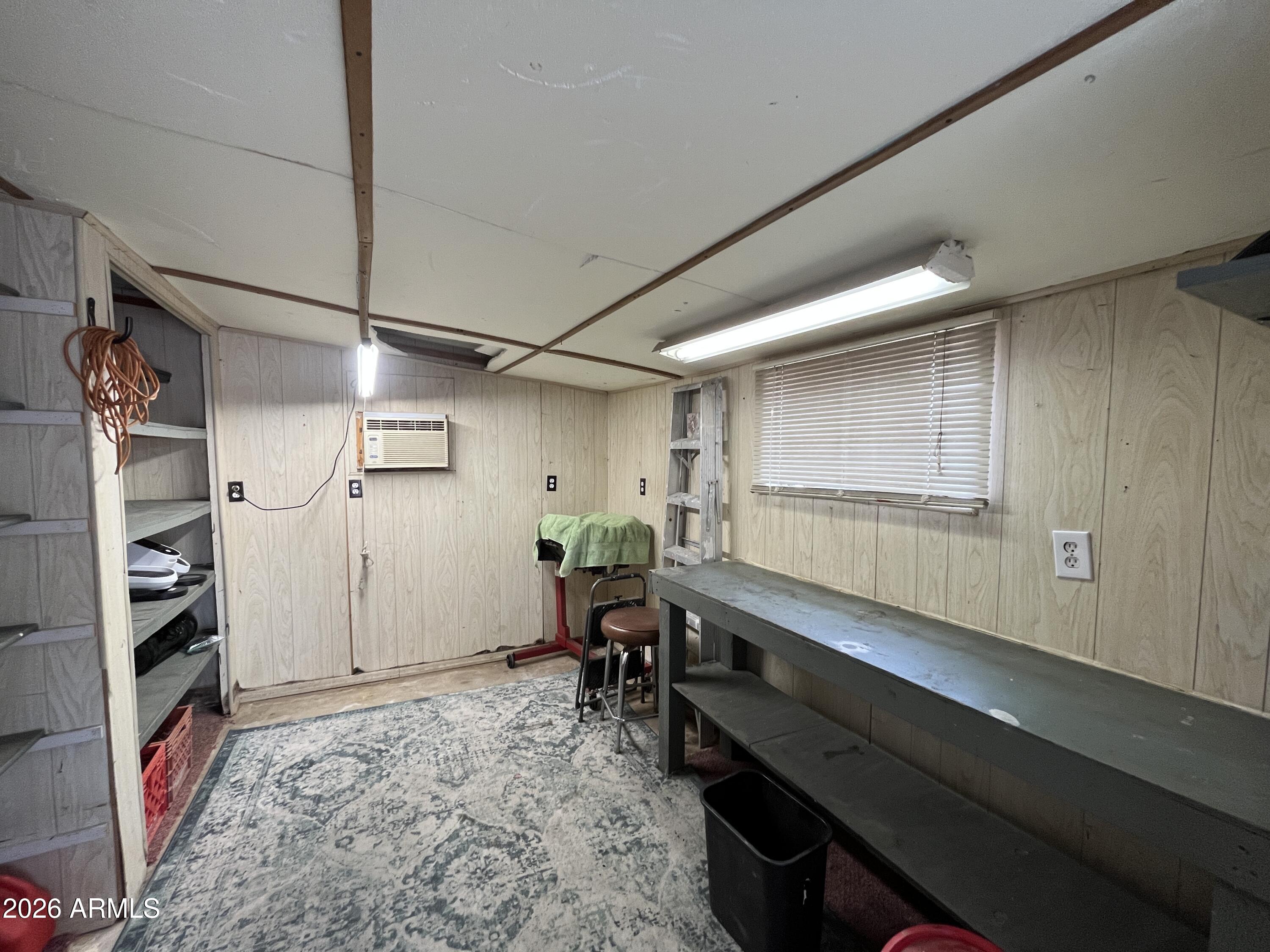 9302 East Broadway Road, Unit 179 Mesa, AZ 85208 - Photo 42 of 54 a room with furniture and a window