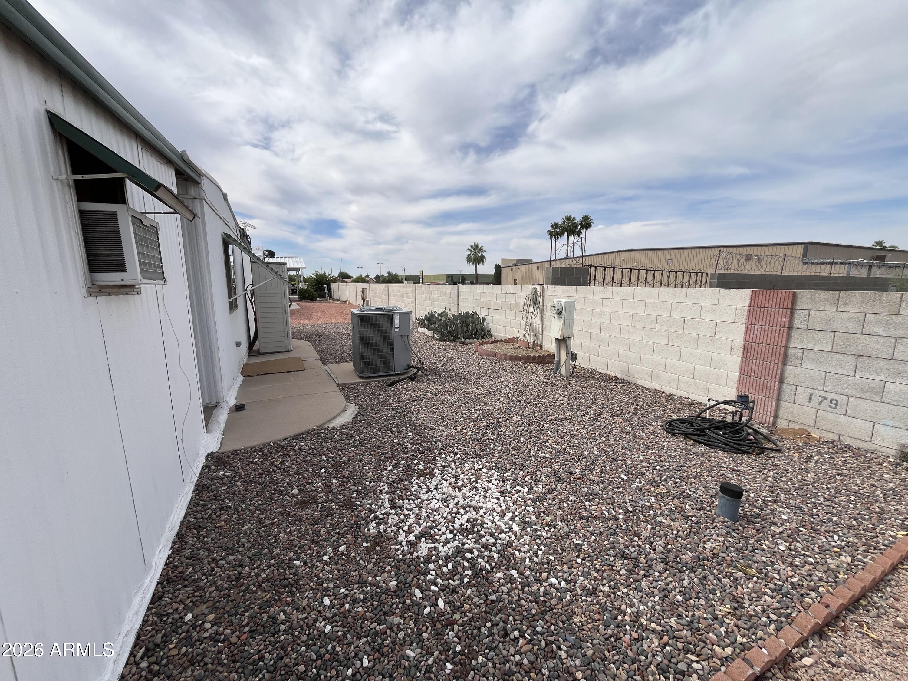 9302 East Broadway Road, Unit 179 Mesa, AZ 85208 - Photo 47 of 54 a view of a backyard of the house