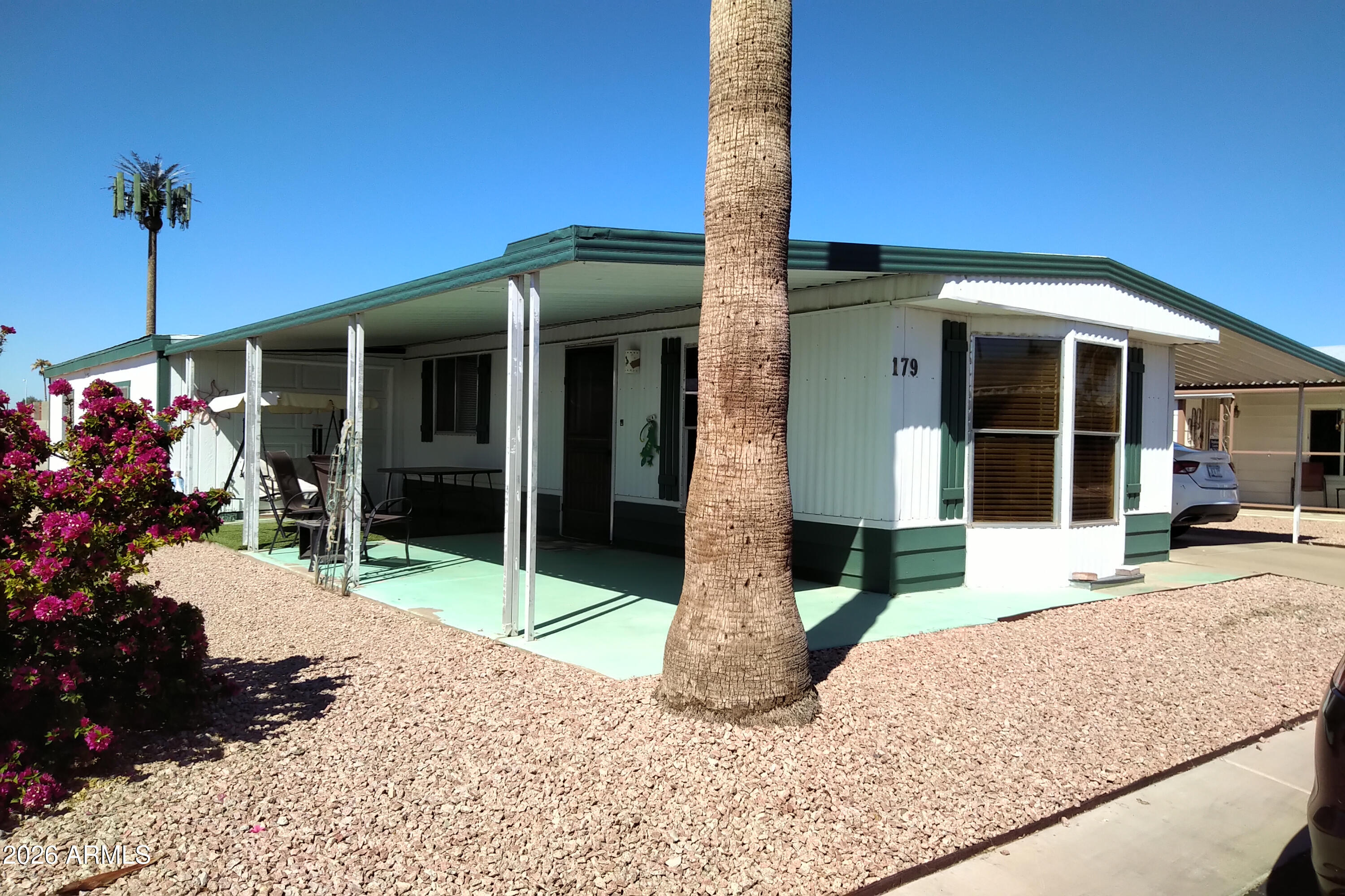 9302 East Broadway Road, Unit 179 Mesa, AZ 85208 - Photo 54 of 54 a front view of a house with porch