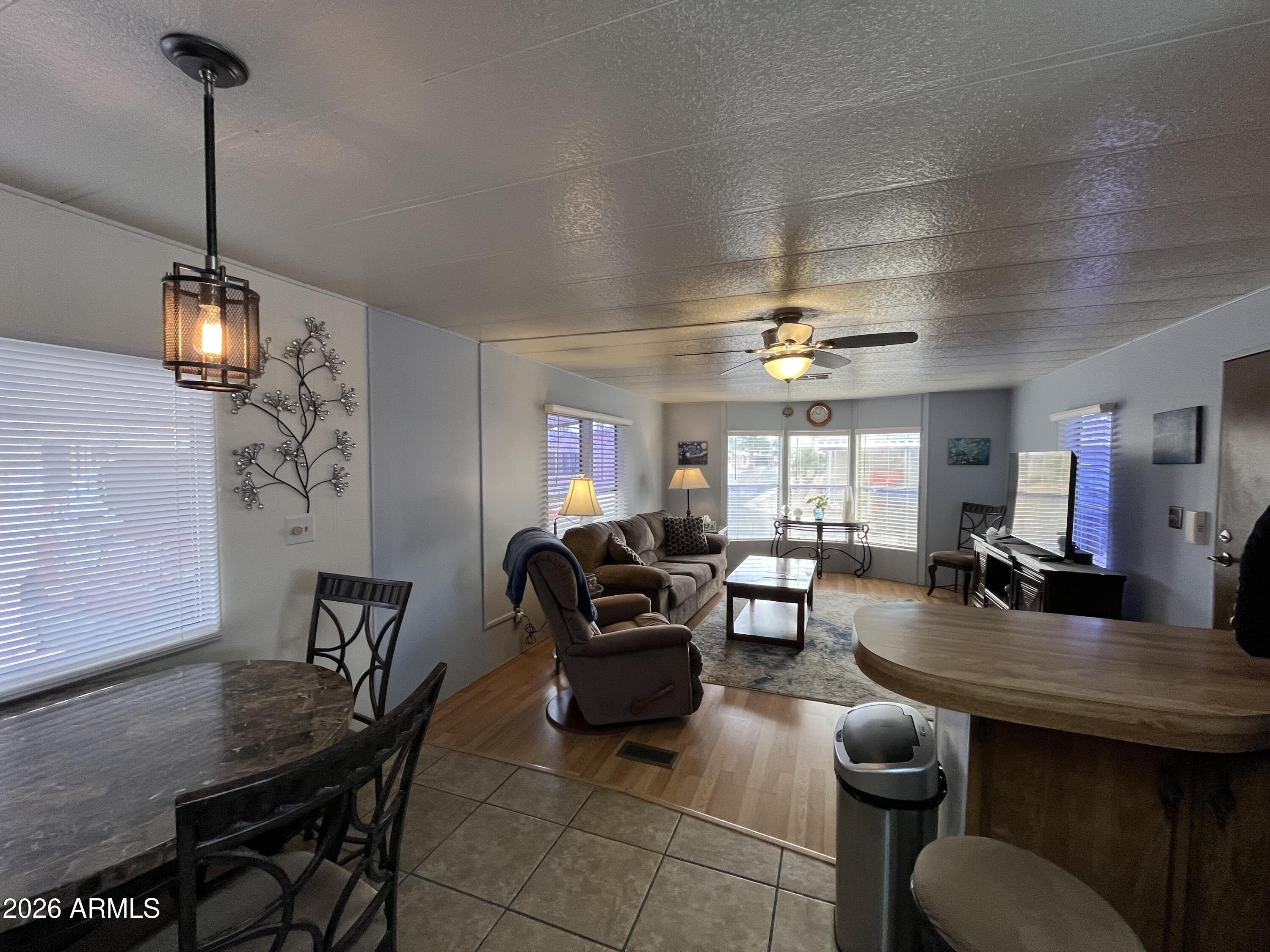 9302 East Broadway Road, Unit 179 Mesa, AZ 85208 - Photo 9 of 54 a living room with furniture